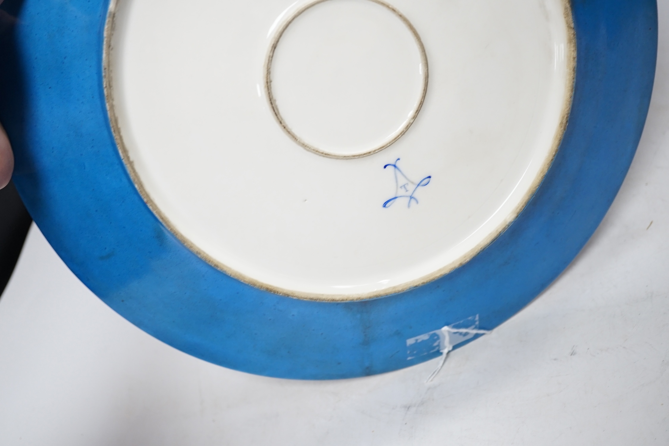 A Sevres style dish decorated with amorini, 33cm